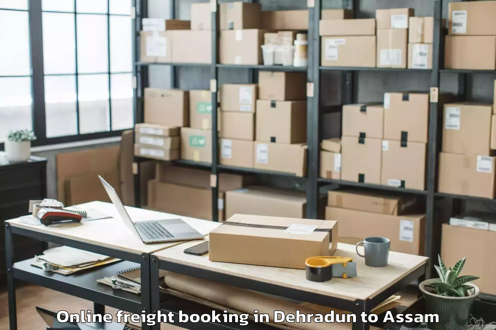 Dehradun to Kalaigaon Online Freight Booking Booking